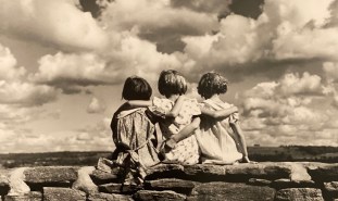 Three girls overlooking the ocean